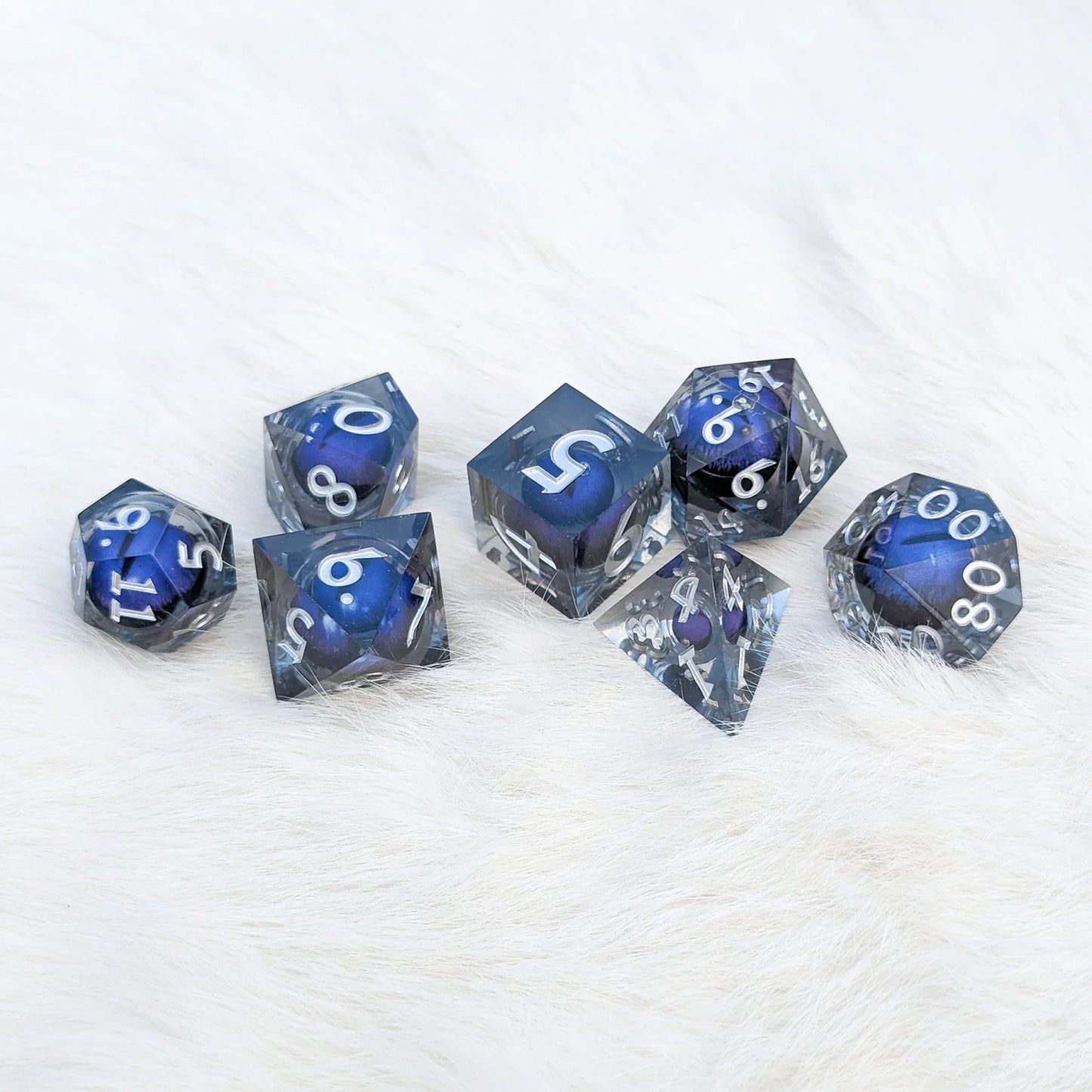 Blue Moving Eye - 7 piece liquid core sharp - edge dice set - The Fourth Place