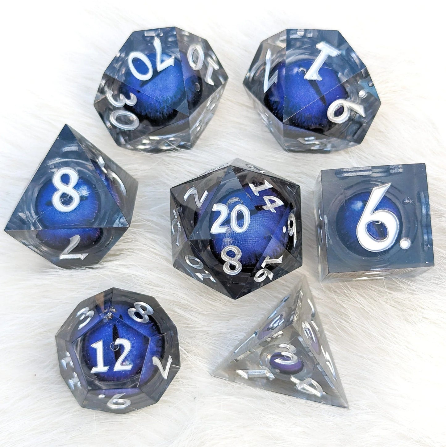 Blue Moving Eye - 7 piece liquid core sharp - edge dice set - The Fourth Place