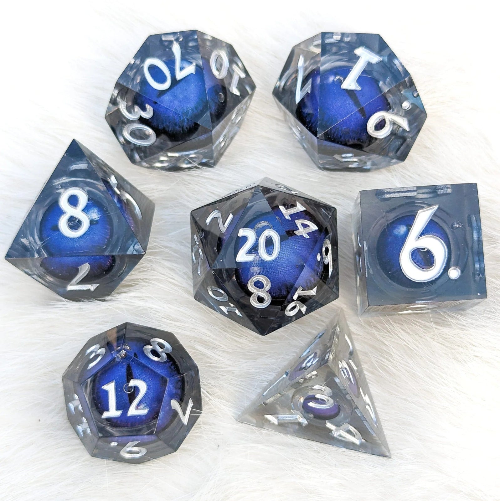 Blue Moving Eye - 7 piece liquid core sharp - edge dice set - The Fourth Place