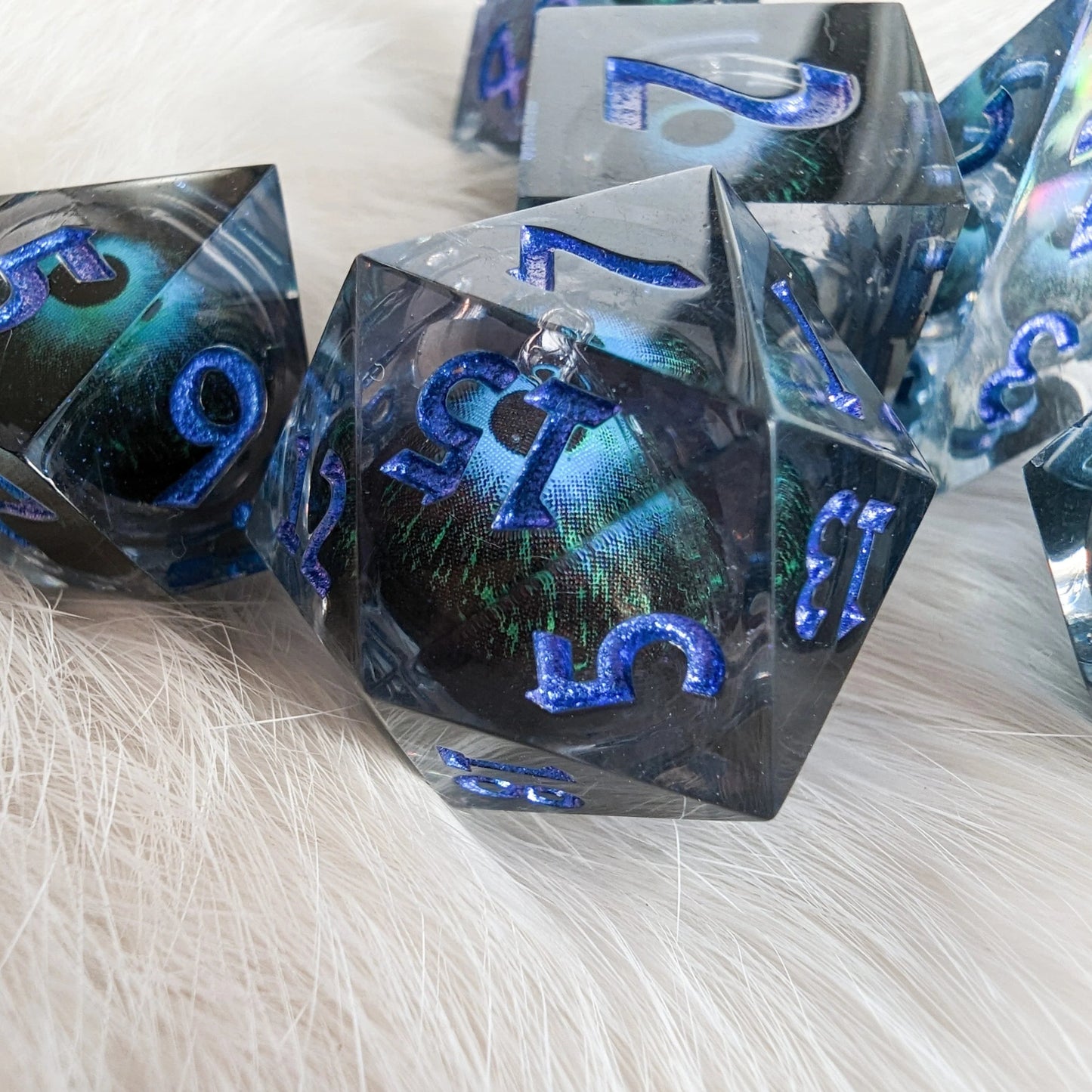 Moving Eye - 7 piece liquid core sharp - edge dice set - The Fourth Place