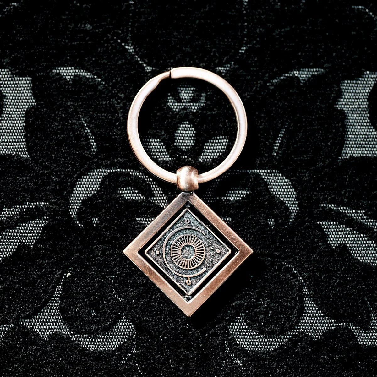 Candela Obscura Spinning Keychain - The Fourth Place